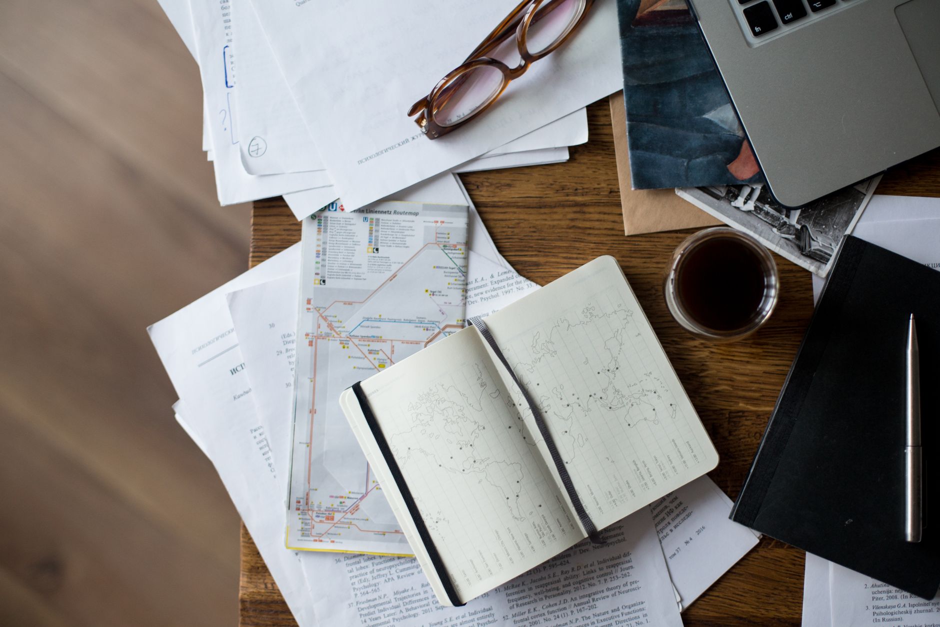 Handmade map and coffee on rustic wooden table